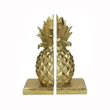 Librero en forma de piña color dorado
